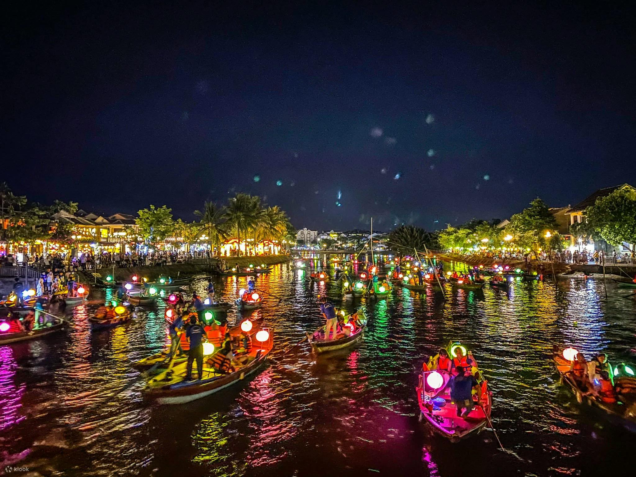 Releasing flower lanterns on Hoai River, Hoi An